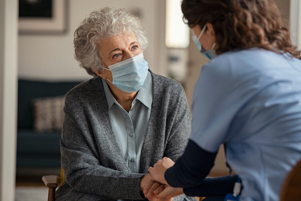 Elderly,Woman,Talking,With,A,Doctor,While,Holding,Hands,At