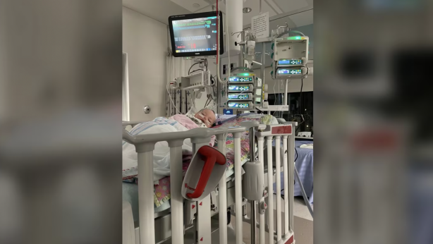 Scott MacMillan's daughter Rosemary in a hospital bed.